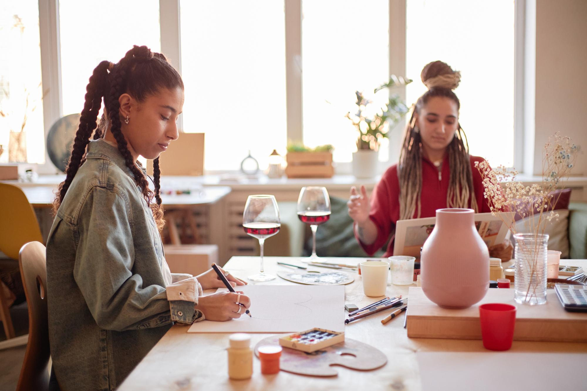 Students tasting and taking notes at a long table